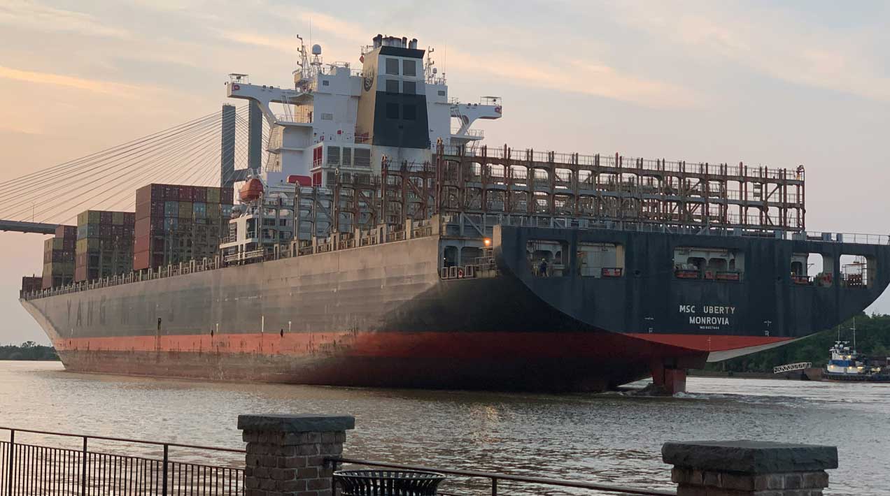 Cargo ship docked near the Port of Savannah, a key gateway for customs bonded warehousing and Southeast U.S. distribution.